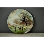 A Poole plate; Landscape in Winter after a painting by B.C. Loekkoek 1803-1862, 13cm diameter.