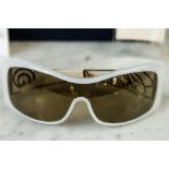 A pair of Chopard sunglasses, no. CH441873, togeth