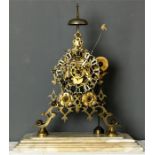 A 19th century gilt brass skeleton clock, raised on a stepped white marble base, the dial having