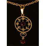 A 9ct gold pendant, set with red paste stones. 1.3g, with a plated chain.
