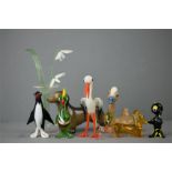 A group of 1960s glass ornaments; parrot, penguin, crane, octopus, sausage dog, vase of snowdrops, a