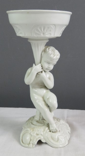 A white ceramic figure of a cherub raising a dish. - Image 3 of 30