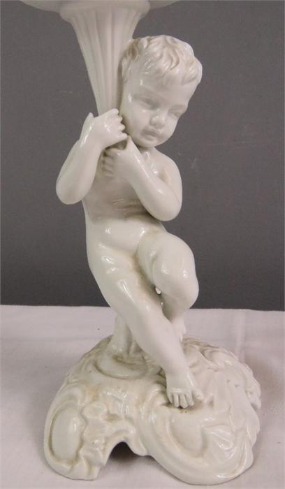 A white ceramic figure of a cherub raising a dish. - Image 18 of 30