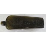 An excavated brown glass bottle 'African' of square tapered form.