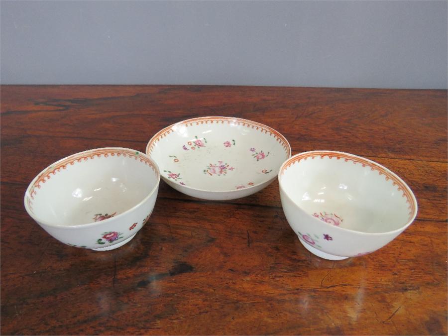 A pair of Newhall 19th century teabowls and matching dish, painted with flowers. - Image 4 of 45