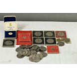 A quantity of commemorative coins including three Isle of Man one Pound mint coins, an Isle of Man