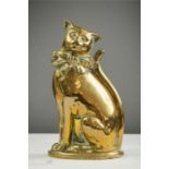 A cast brass door stop in the form of a cat.