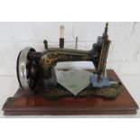 A Singer sewing machine with instruction manual.