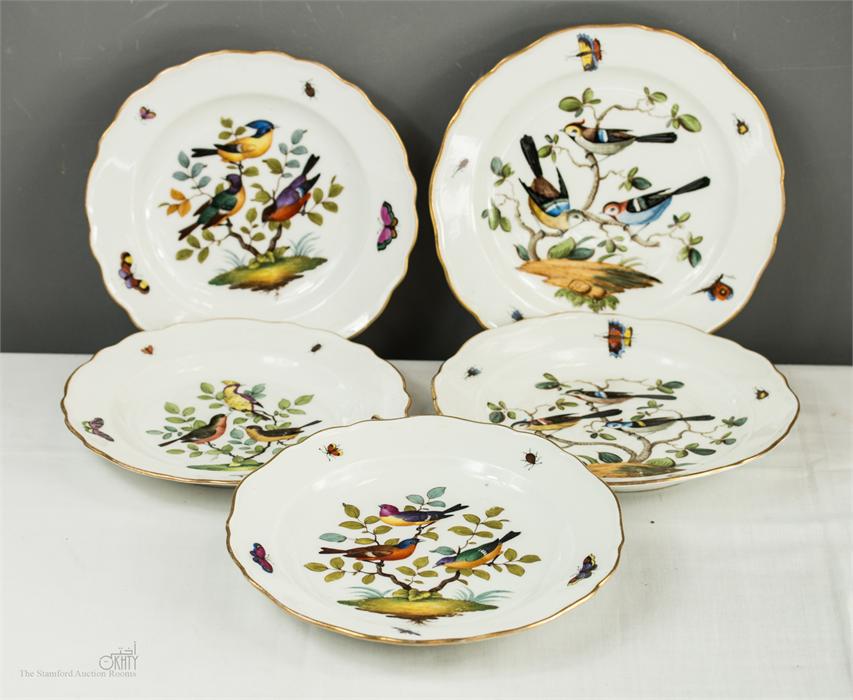 Three 19th century Meissen and two Dresden plates, each having shaped and gilded edges painted