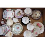 A group of porcelain tea cups and saucers.