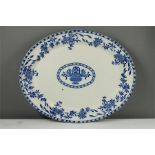 A blue and white Wood & Co meat platter of oval form.