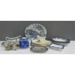 A group of ceramics including oval platters, blue and white tea pot, miniature willow pattern plate,