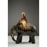 A kitch ceramic Indian elephant and Mahoot.