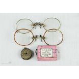 Two pairs of Edwardian Pince Nez spectacles, watch mechanism.