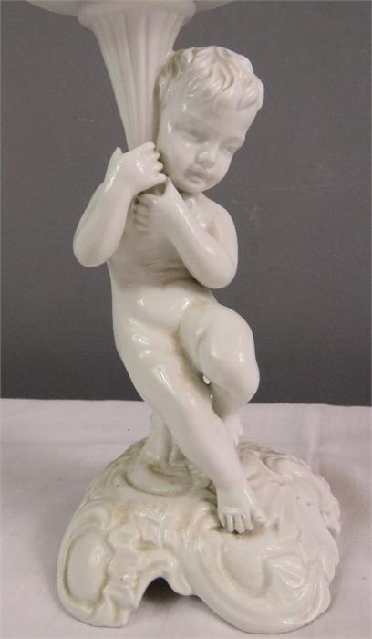 A white ceramic figure of a cherub raising a dish. - Image 24 of 30