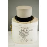 A Lock & Co Hatters grey top hat together with the original box with makers label.