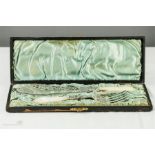 A white metal fish slice and fork with mother of pearl handles in original presentation box.