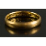 A 22ct gold wedding band, size N, 3.9g.