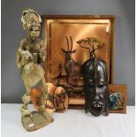 A quantity of African items including tribal figure and copper plaques.