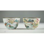 A pair of Chinese late 18th/early 19th century enamel on copper tea bowls depicting birds amidst