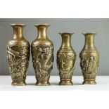 A group of four bronze Chinese style vases, cast with decoration.