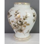 A white porcelain vase painted with flower, marked D to the base in blue.