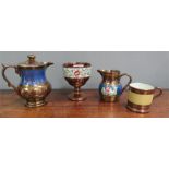 A group of Victorian lustreware; two jugs, a goblet and a mug.