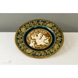 An Austrian majolica relief moulded charger, no 450 impressed to the base, 32cm diameter.