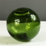 A green glass fishermans ball.