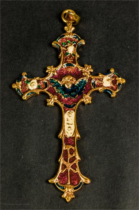 A yellow metal and enamel cross.