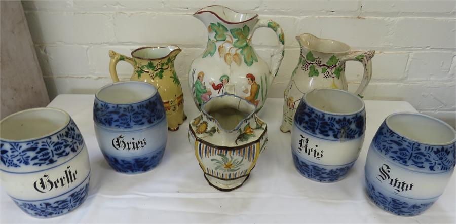 A group of miscellaneous ceramics, including Prattware jugs, four stencilled barrels.