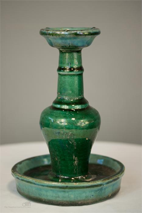 A Chinese green stone-glazed oil lamp, 20cm high.