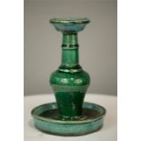 A Chinese green stone-glazed oil lamp, 20cm high.