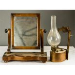 A small Victorian mahogany toilet mirror, together with an oil lamp.