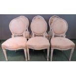 A set of six painted balloon back Regency French style chairs, with upholstered oval backs and