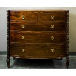 A 19th century mahogany chest of drawers, with unusual turned corner columns flanking the two