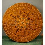 A marquetry yew wood circular table top, possibly Killarney, inlaid with various specimen woods in a