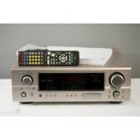 A Denon amplifier AV surround receiver AVR 1906 with instructions and remote control.