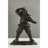 A bronze figure of a Samourai warrior