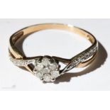 A 9ct gold and diamond seven stone cluster ring approx. .25ct, size O 1.2g.