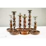 Three pairs of treen candlesticks with barleytwist stems.