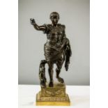 A 19th century spelter statue of a Roman, raised on a brass plinth, 41cm high.