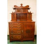 An unusual carved walnut sideboard dated 1916, with original brass handles, five drawers and