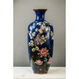 A 19th century Chinese cloisonne vase, depicting a group of peonies, chrysanthemum, and prunus