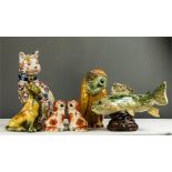 A collection of ceramic animals to include an Imari style cat, a stoneglazed fish and an owl.