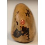 A Chinese carved bottle, polished nut bearing an inlaid coral tag engraved with calligraphy, and a