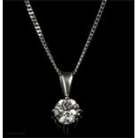 An 18ct white gold and diamond pendant; approx .60ct, on a 9ct white gold chain.