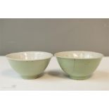 A pair of Chinese celadon bowls, with footed bases.