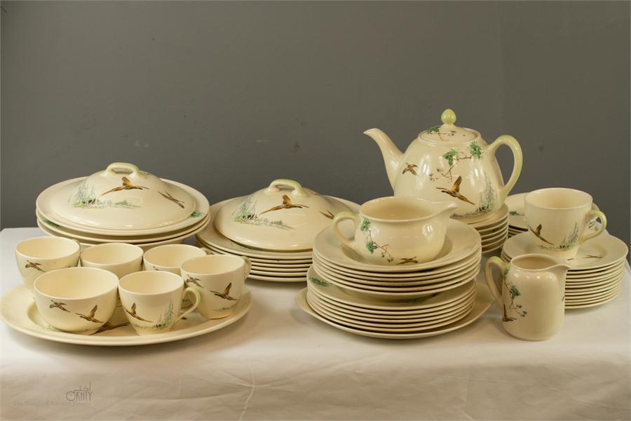 A 1930s Royal Doulton part dinner and tea service in The Coppice pattern, to include two lidded