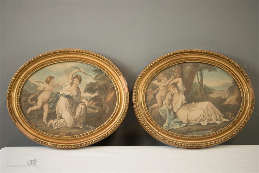 A pair of 19th century oval prints; Cupid Binding Aglaia to a Laurel, and Cupid Disarmed by